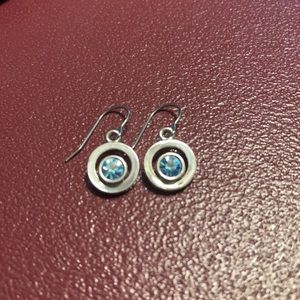 Silver tone earrings with blue stone